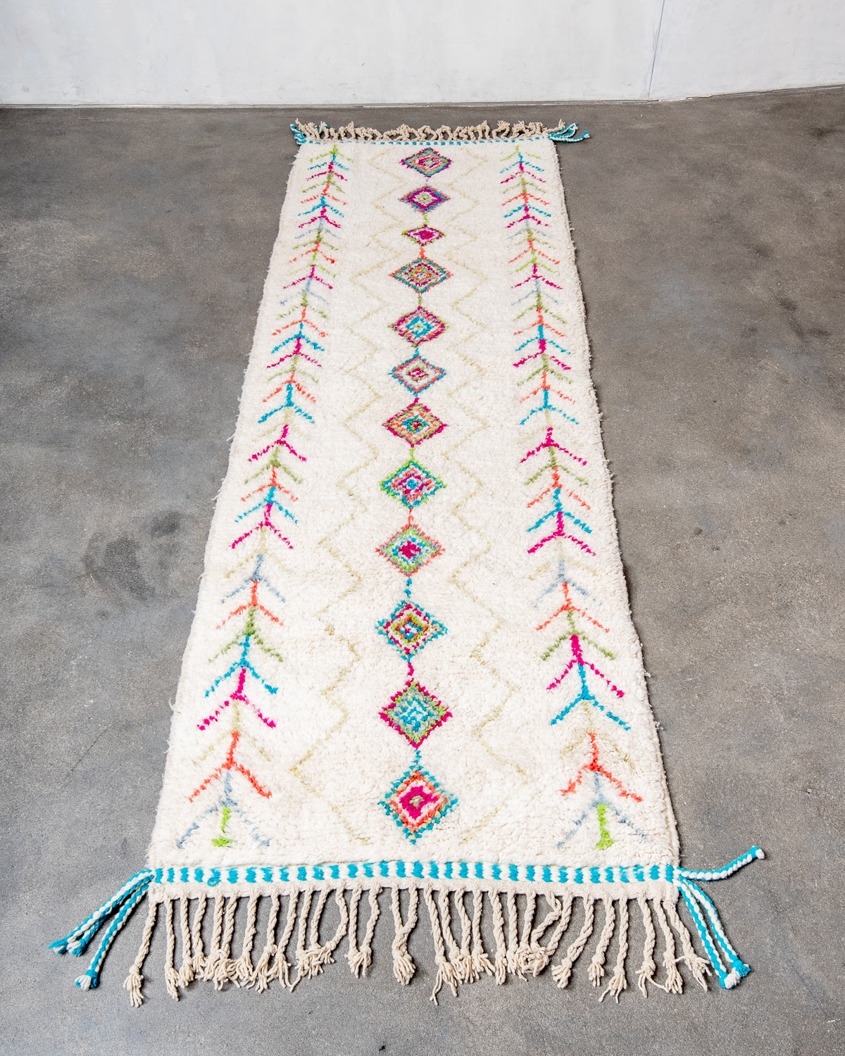 Modern, designer, handcrafted Berber runner rug from Morocco. Beniourain carpet with beautiful colours and patterns and fluffy wool texture.